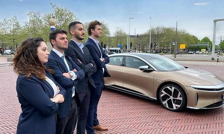 Winning team going for the Fast and the Furious Pose before the test drive on the Lucid Dream. 